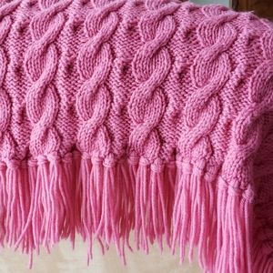 Cable knit afghan.
